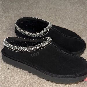 UGG Black Slippers with Cozy Fuzzy Material and Decorative Trim